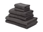 A stack of dark gray bath towels.
