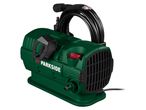 A green and black Parkside pressure washer with a coiled hose.