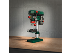 A Scheppach bench drill press sits on a wooden workbench against a concrete wall.