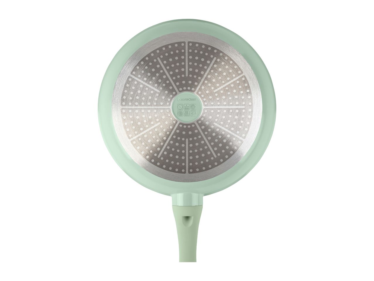 Bottom of a light green frying pan with a metallic, dotted induction base.