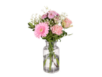 Gérberas, rosas e outras flores rosas num vaso.