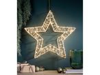 Illuminated star decoration with warm white lights, pine branches, and Christmas gifts.