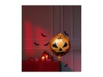 Halloween decorations with a pumpkin balloon, bats, and candles.