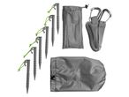 Camping gear including tent stakes, storage bags, and straps with carabiners.
