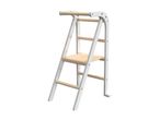 White and natural wood learning tower for children, with a safety rail and adjustable step.