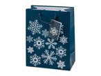 Dark blue gift bag with white snowflake pattern and a matching gift tag.