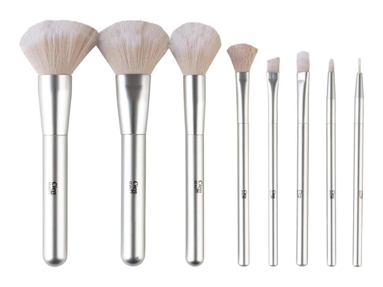 Seven silver-handled makeup brushes, including three large powder brushes and four smaller detail brushes.