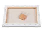 Back of a stretched canvas with wooden stretcher bars and a bag of wooden keys.
