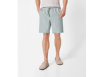 Man wearing light grey shorts with a green drawstring and beige clogs.