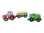 Red toy tractor pulling a trailer with hay bales, and a green toy combine harvester.
