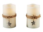 Two cream-colored LED candles with jute rope and a silver star charm