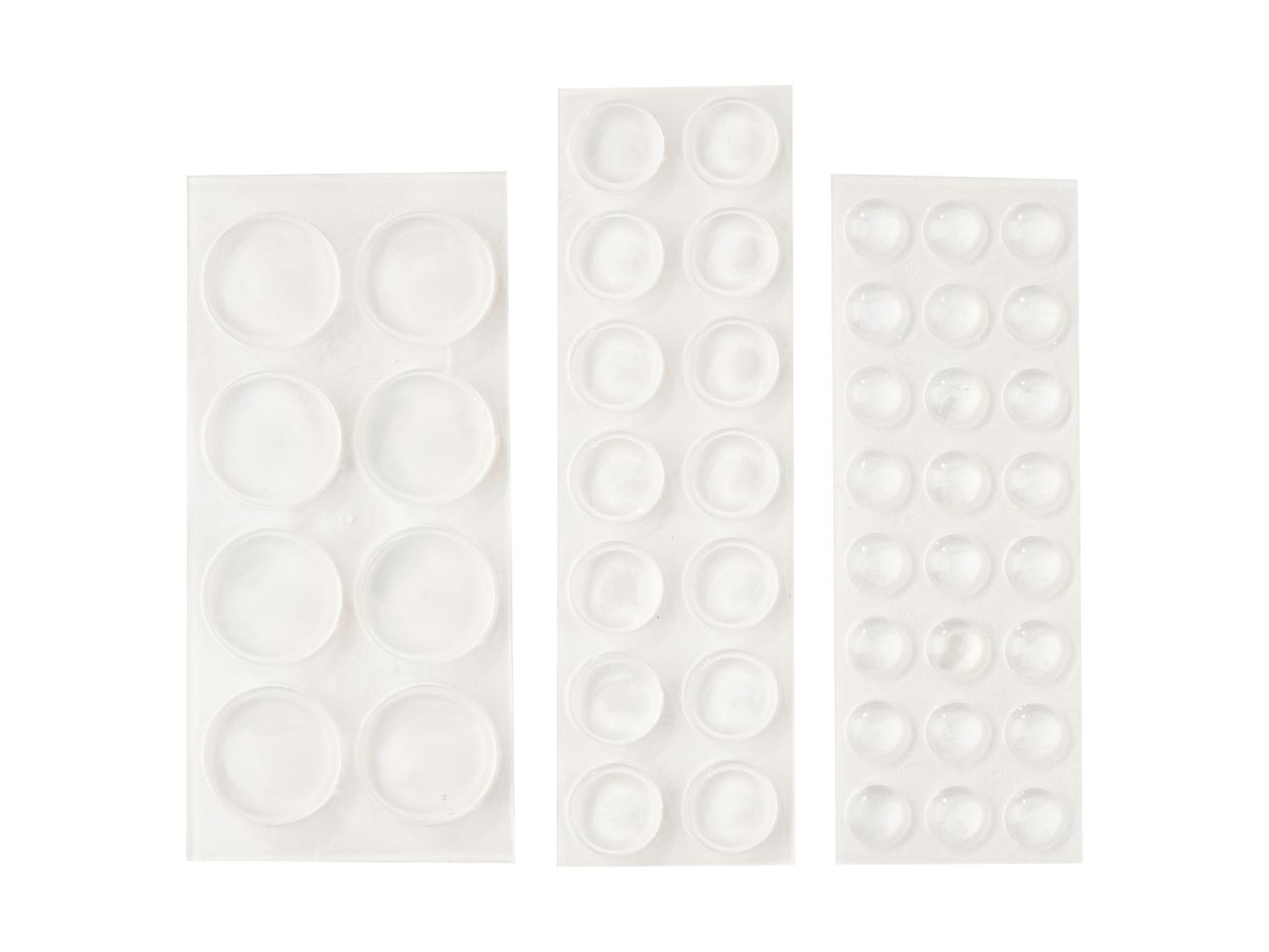 Three sheets of clear, circular furniture pads in varying sizes