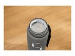 Top-down view of a grey water bottle with a white strainer and measurement markings.