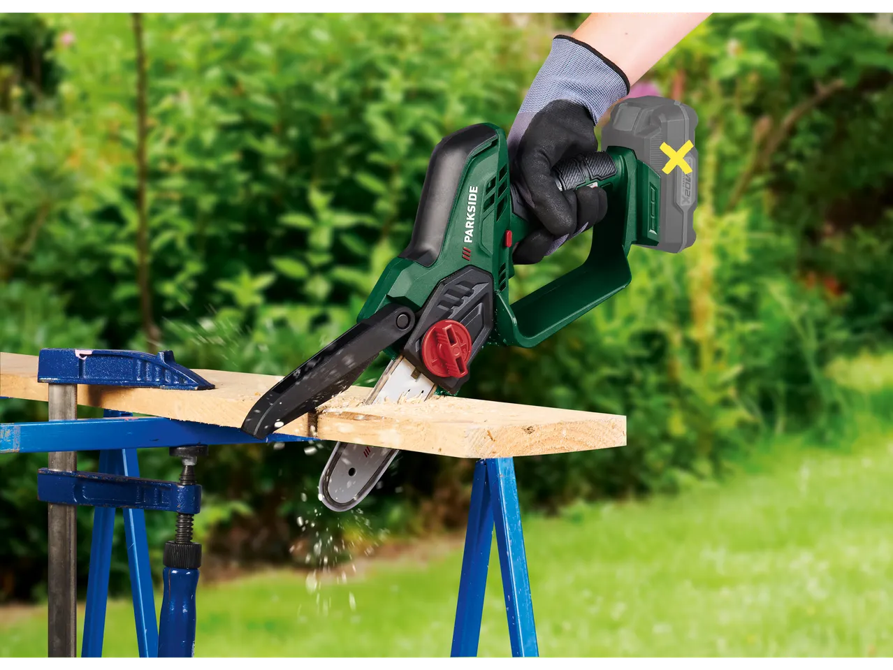Parkside® 20 V cordless shrub cutter cutting a wooden board