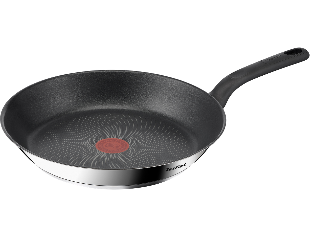 En Tefal stekpanna med svart handtag och prickig botten.