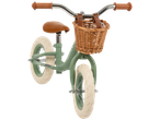 Mint green balance bike with wicker basket.