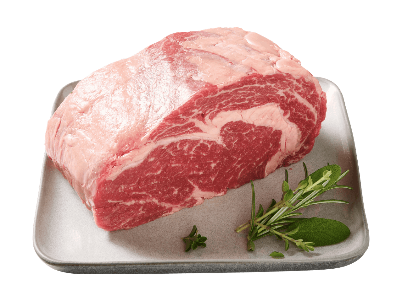 Roher Rinderbraten mit Kräutern auf einer grauen Platte.