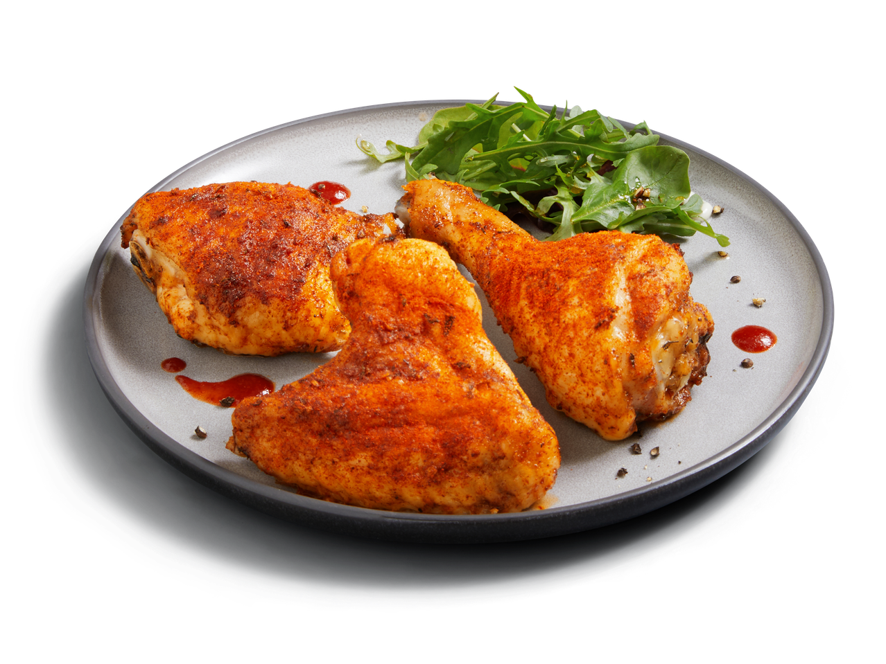 Gebratene Hähnchenkeulen mit Rucola.