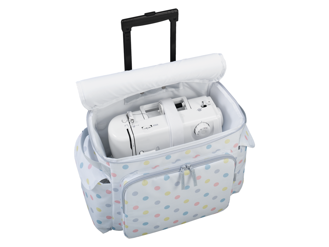 Sewing machine in a polka dot rolling bag.