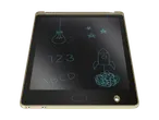 A beige LCD writing tablet displays hand-drawn images of a lightbulb, stars, numbers, letters, a rocket, and a tangled mess.