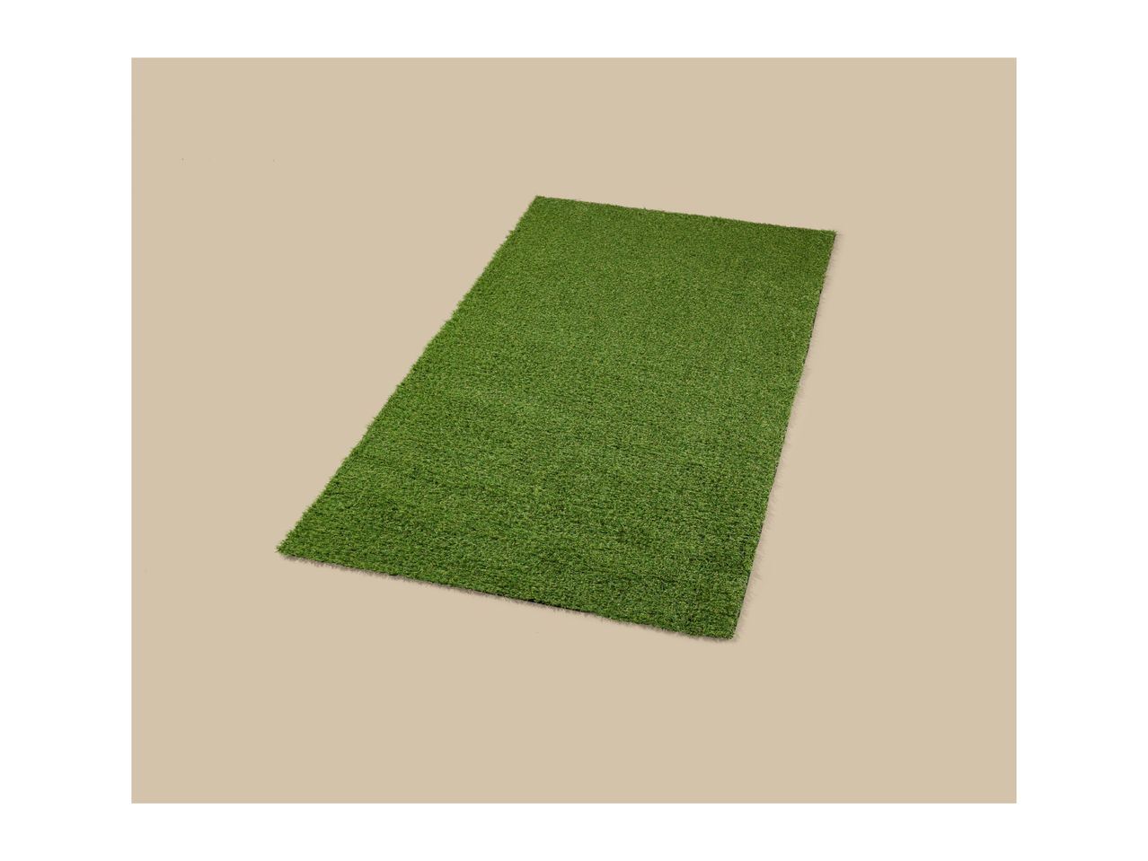 Rectangular artificial grass mat on a beige background.