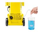 Yellow pressure washer with a tube drawing blue liquid from a beaker.