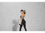 Woman working out with dumbbells.