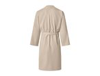 Back view of a beige waffle-knit bathrobe with a tie belt.