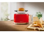 SILVERCREST® 2-Slice Toaster in red with a bun on top, next to bread rolls.