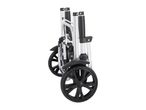 Folded silver and black shopping trolley with two wheels, side view.