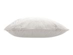 White decorative cushion with embroidered leaf patterns