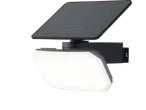 Solar-powered LED floodlight with an integrated solar panel on a black background.