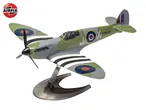 A model airplane, a Spitfire, in green and grey camouflage with a propeller and a stand.