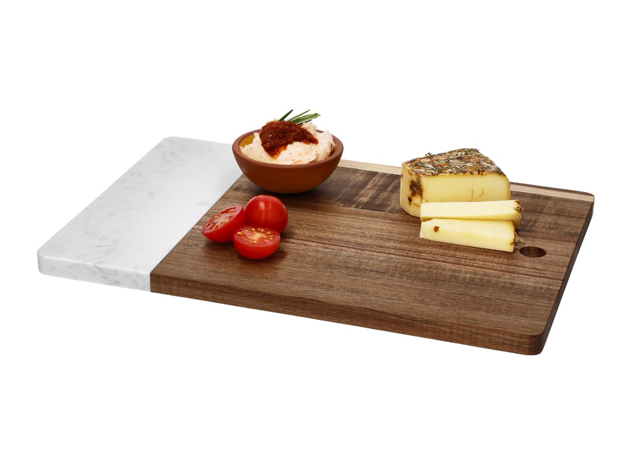 Marble and wood serving board with cheese, spread, and cherry tomatoes.