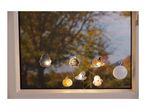 Halloween string lights with haunted house, cauldron, witch, pumpkin, and ghost shapes.