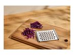Red cabbage, shredded and whole, with a metal grater on a wooden cutting board.