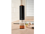 SILVERCREST® Electric Salt/Pepper Mill on a kitchen counter with salt, garlic, and herbs.
