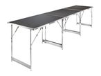 Long, foldable camping table with a dark grey surface and silver aluminum frame.