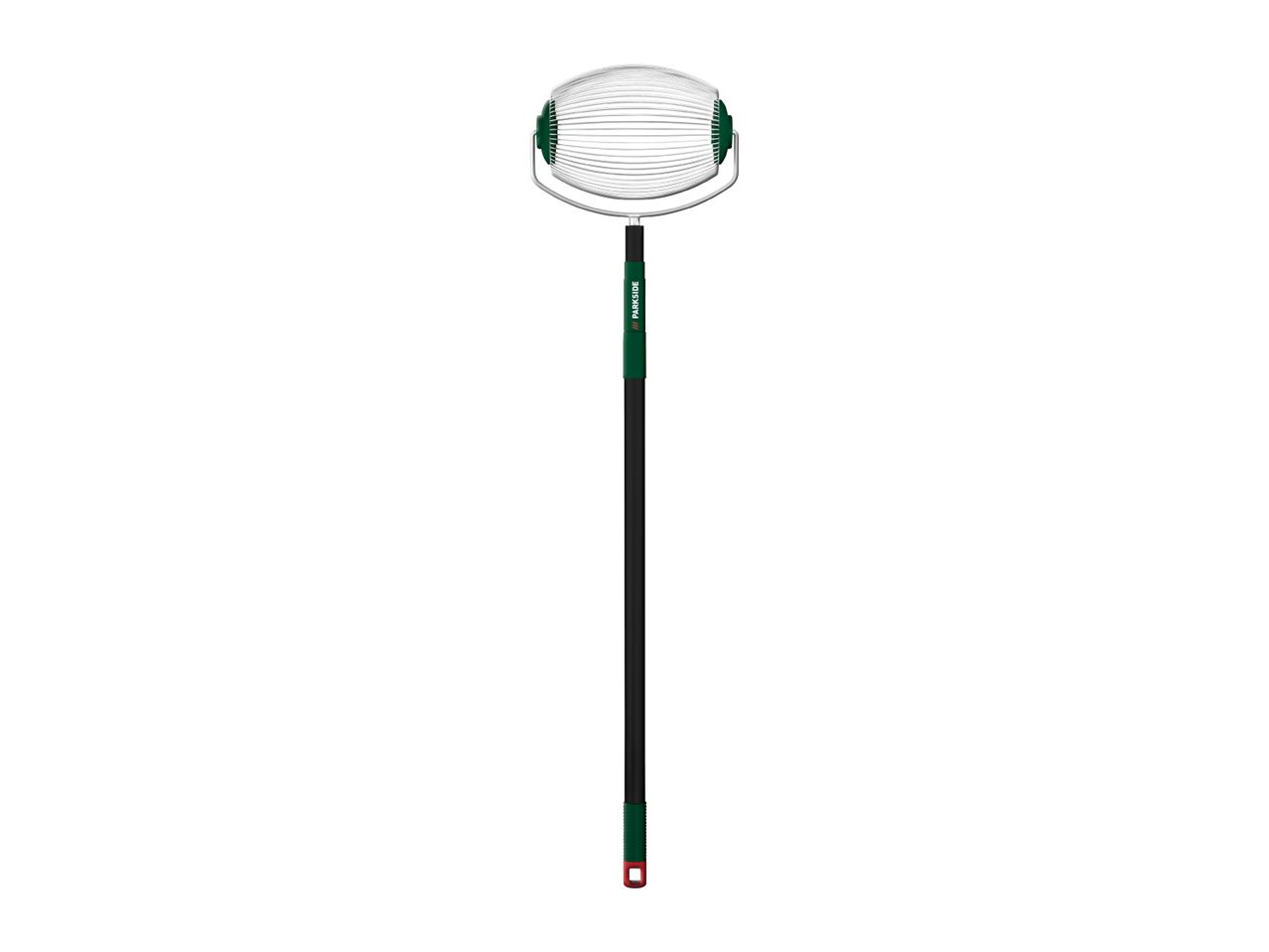 Nut gatherer with a long black and green handle and a wire cage at the top.
