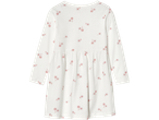 Vit långärmad klänning med rosa blommönster.