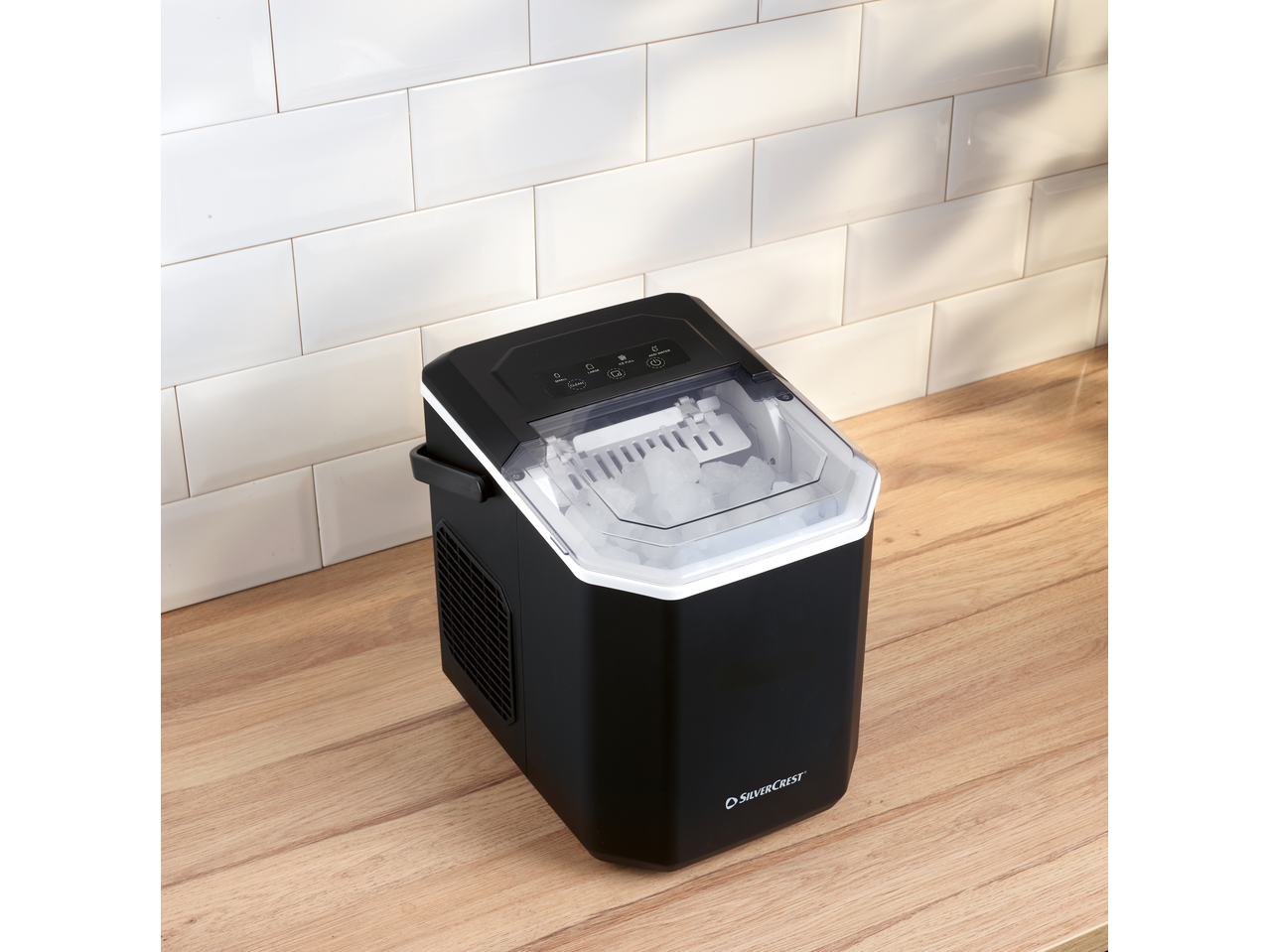 SILVERCREST® Ice Maker on a wooden counter with white tiled backsplash