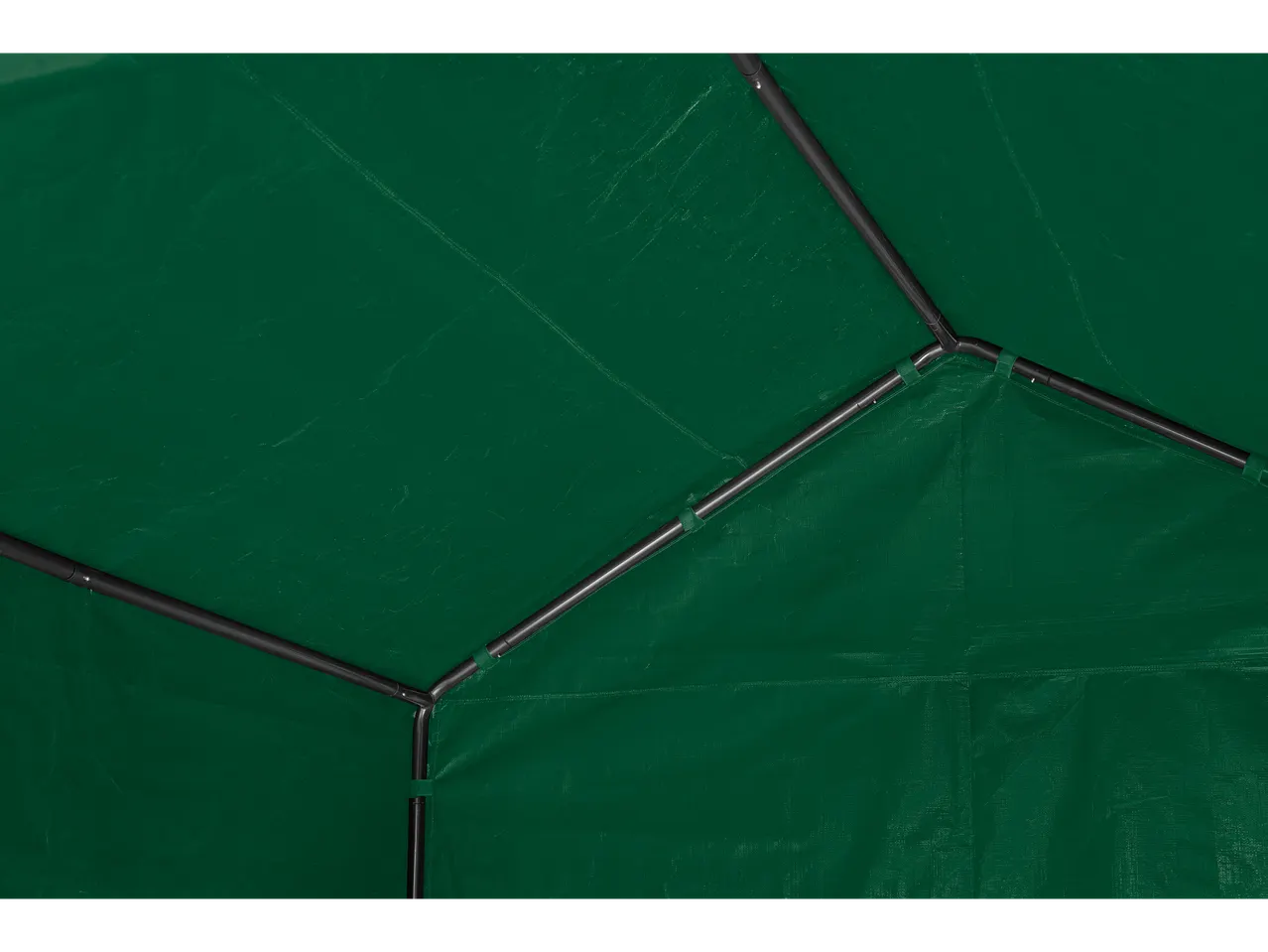 Interior of a green tarp, with visible black metal poles