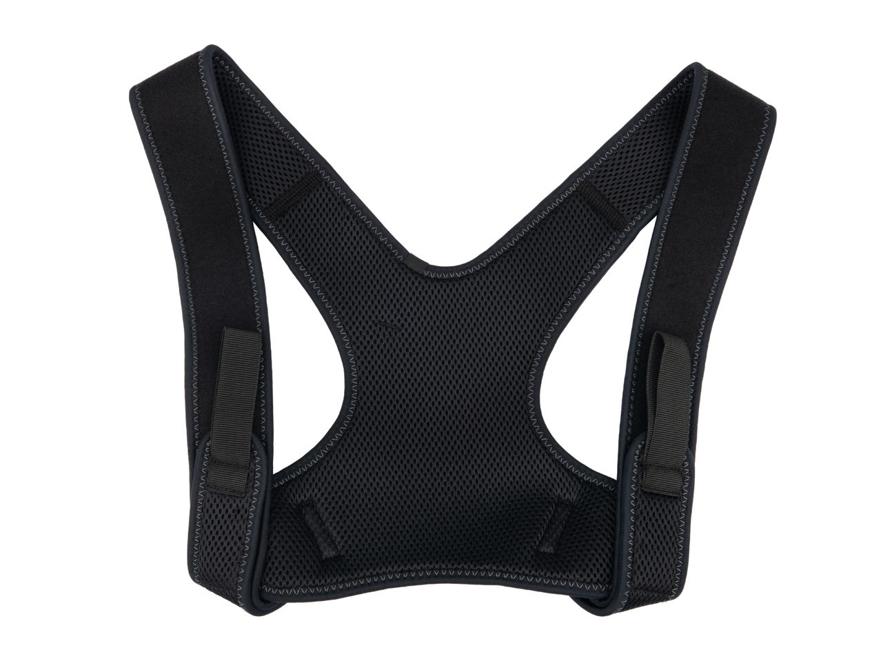 Black posture corrector with mesh back and adjustable straps.