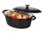 Black cast iron Dutch oven with a lid, filled with roasted chicken and vegetables.