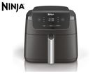 Black air fryer with digital display showing 210, and control buttons.