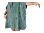Man wearing a green hooded surf poncho with a front pocket