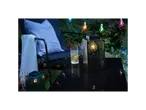 Lit garden lanterns and relaxing garden atmosphere.