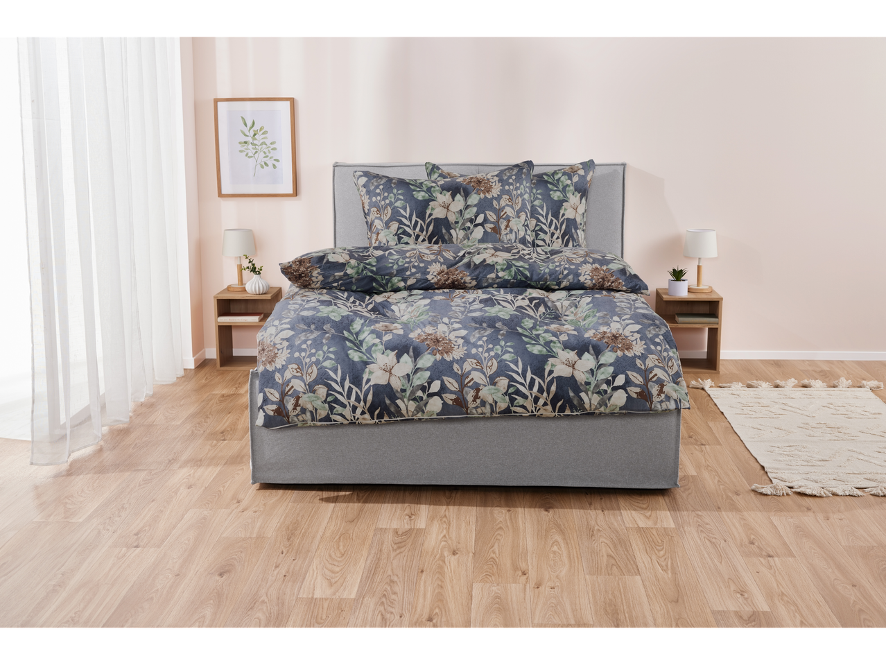 Floral bedding set on a gray platform bed in a minimalist bedroom.