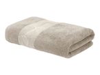 Folded beige towel with a decorative leaf pattern.
