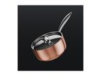 A copper saucepan with a stainless steel lid and handle against a dark background.